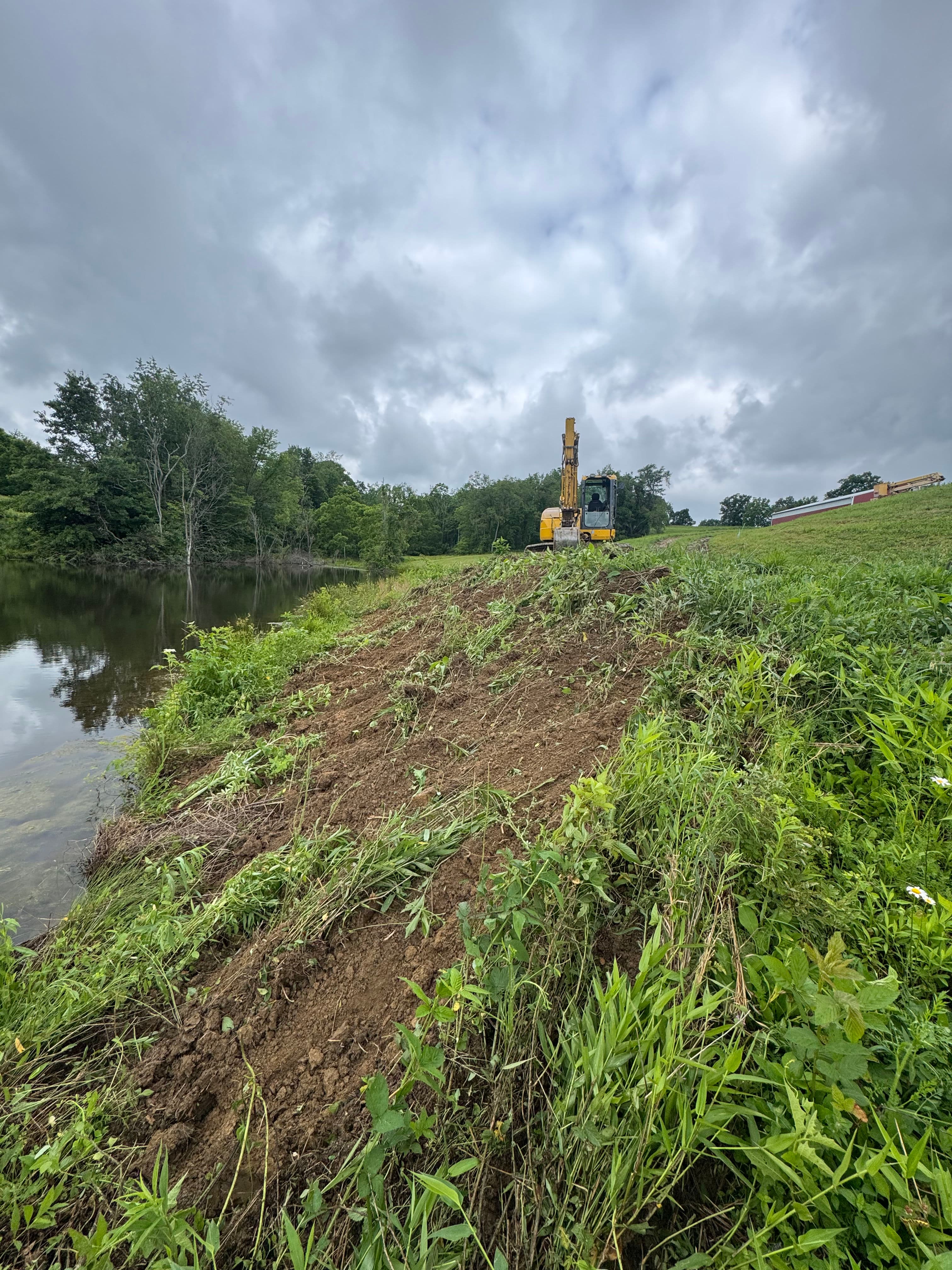 Project Building Retaining Walls Along a Pond for Outdoor Entertaining image